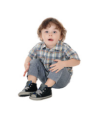 Image showing Little three year boy sitting on floor.