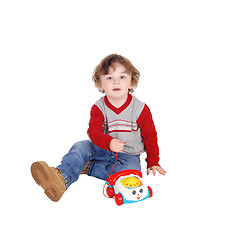 Image showing Portrait of little boy with his toy phone.