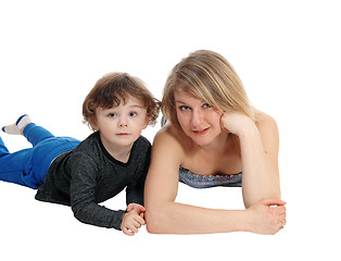 Image showing Mother and son lying on floor.