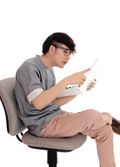 Image showing Asian man working at his laptop.