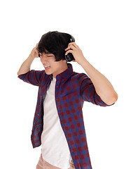 Image showing Asian man listen to music.