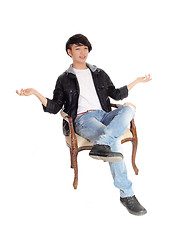 Image showing Asian teenager sitting and don't know.