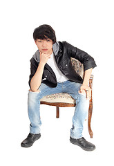 Image showing Asian teenager sitting in chair.