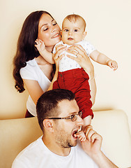 Image showing young happy modern family smiling together at home. lifestyle pe