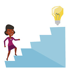 Image showing Business woman walking upstairs to the idea bulb.