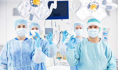 Image showing group of surgeons in operating room at hospital