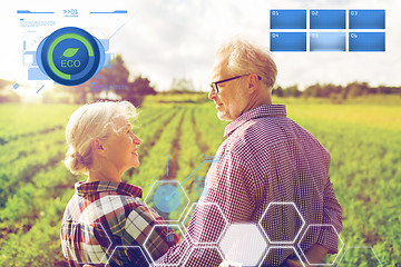 Image showing happy senior couple at summer farm