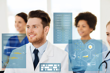 Image showing happy doctor over group of medics at hospital