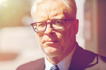 Image showing close up of senior businessman in eyeglasses