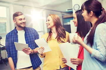 Image showing creative team on coffee break talking at office