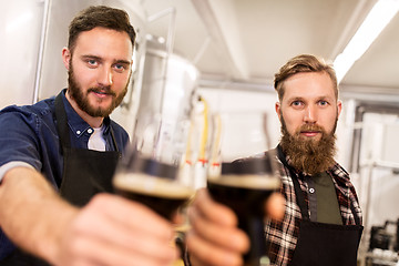 Image showing men drinking and testing craft beer at brewery