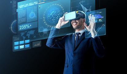 Image showing businessman in virtual reality headset over black