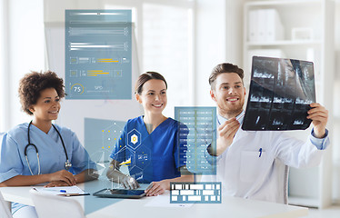 Image showing group of happy doctors looking at x-ray image