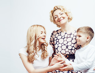 Image showing happy smiling family together posing cheerful on white background, lifestyle people concept, mother with son and teenage daughter isolated 