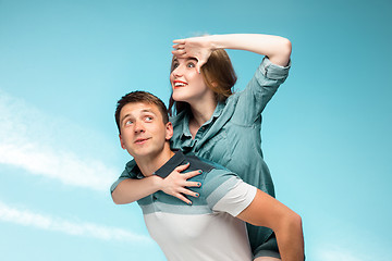 Image showing Young couple smiling under blue sky