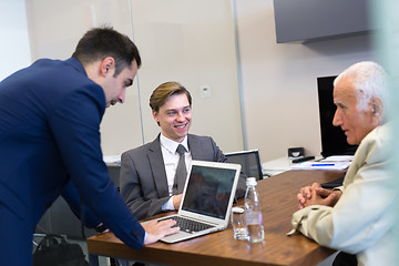 Image showing Business people sitting and brainstorming at corporate meeting.