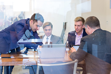 Image showing Business people sitting and brainstorming at corporate meeting.