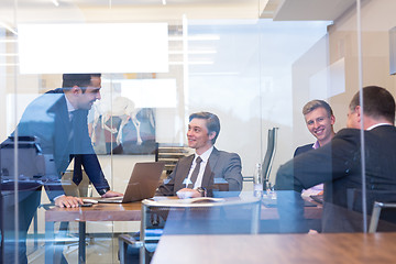 Image showing Business people sitting and brainstorming at corporate meeting.