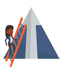 Image showing Businesswoman climbing on mountain.