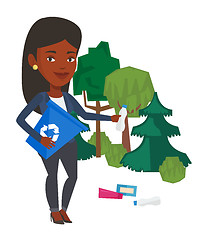 Image showing Woman collecting garbage in forest.