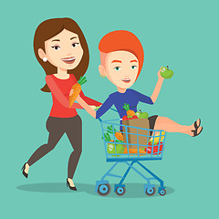 Image showing Couple of friends riding by shopping trolley.