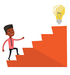 Image showing Businessman walking upstairs to the idea bulb.