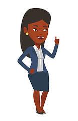 Image showing Smiling businesswoman pointing with her forefinger