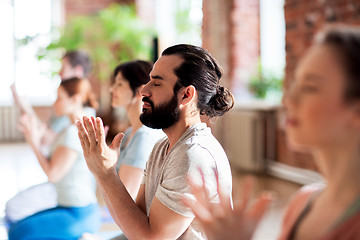 Image showing group of people meditating at yoga studio