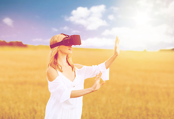 Image showing woman in virtual reality headset on cereal field