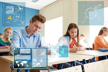 Image showing group of students with books writing school test