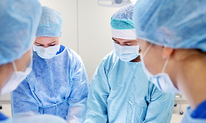 Image showing group of surgeons in operating room at hospital