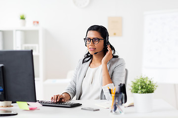 Image showing businesswoman with headset and computer at office