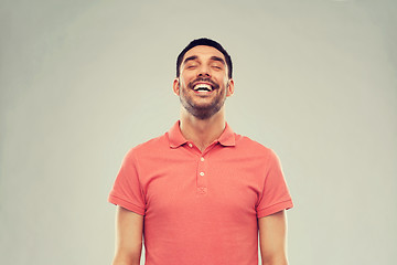 Image showing laughing man over gray background