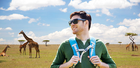 Image showing happy young man with backpack traveling in africa