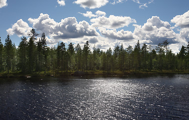 Image showing Lake amongst the woods, cloudy summer sky, Sweden