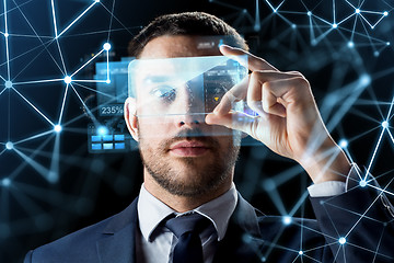 Image showing businessman with transparent smartphone