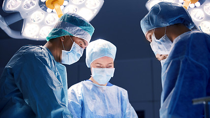 Image showing group of surgeons in operating room at hospital