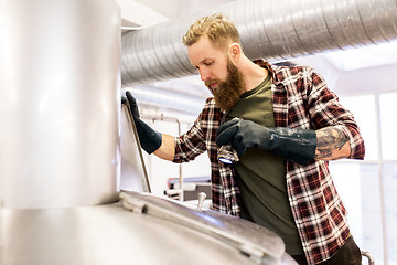 Image showing man working at craft brewery or beer plant