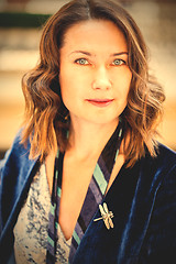 Image showing beautiful woman with a dragonfly brooch