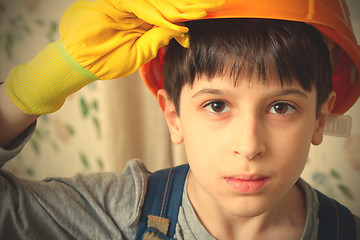 Image showing Boy wearing a protective helmet and gloves
