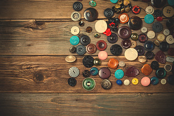 Image showing vintage buttons on the wooden boards