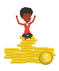 Image showing Happy businesswoman sitting on golden coins.