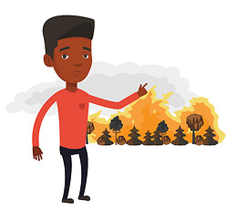 Image showing Man standing on background of wildfire.