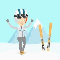 Image showing Cheerful skier standing with raised hands.