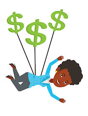 Image showing Businesswoman flying with dollar signs.