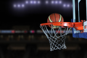 Image showing basketball ball and net on grey background