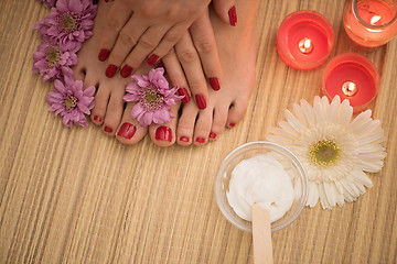 Image showing female feet and hands at spa salon