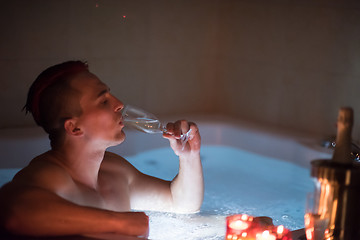 Image showing man relaxing in the jacuzzi