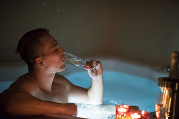 Image showing man relaxing in the jacuzzi