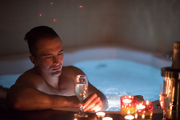 Image showing man relaxing in the jacuzzi